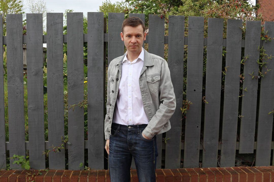 Grey denim jacket outfit with white shirt and blue jeans