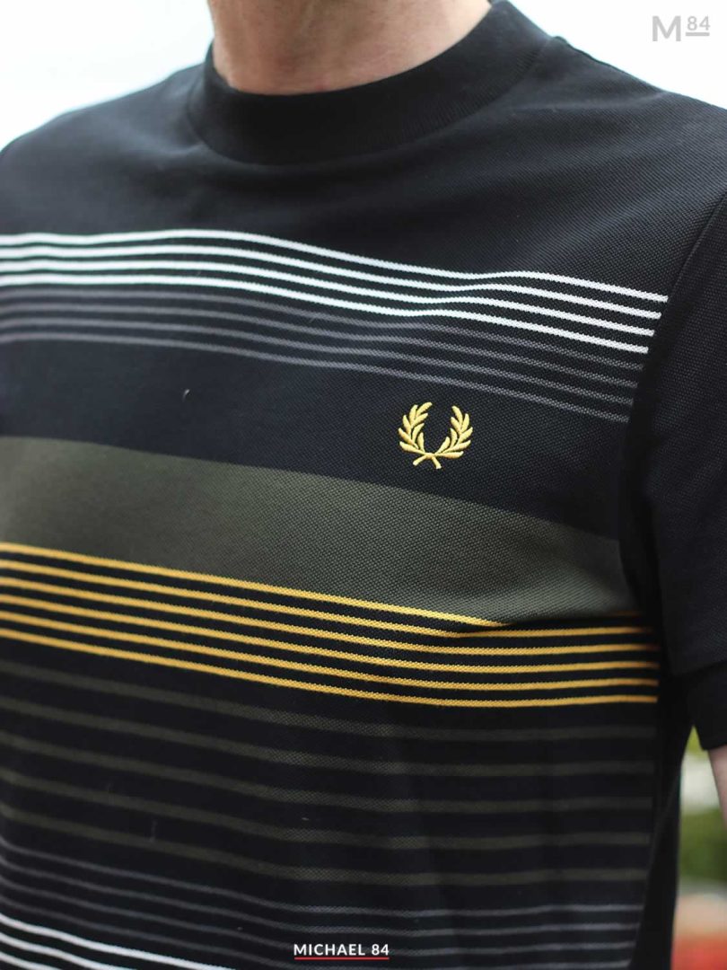 Close up of the Fred Perry T Shirt in black with stripes