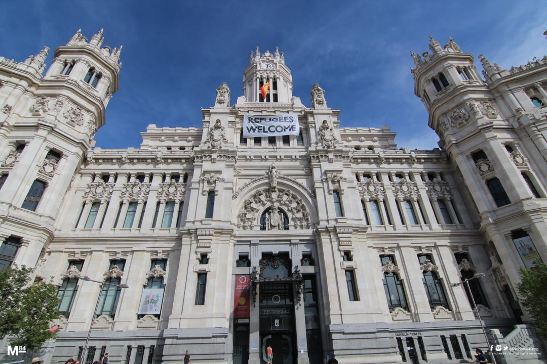 Refugees Welcome Banner On Palacio Cibeles