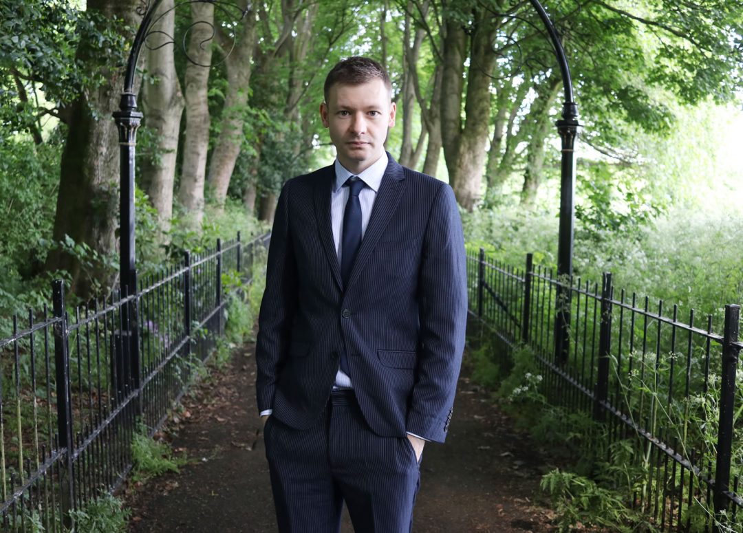 Wearing A Navy Suit And Tie For A Wedding