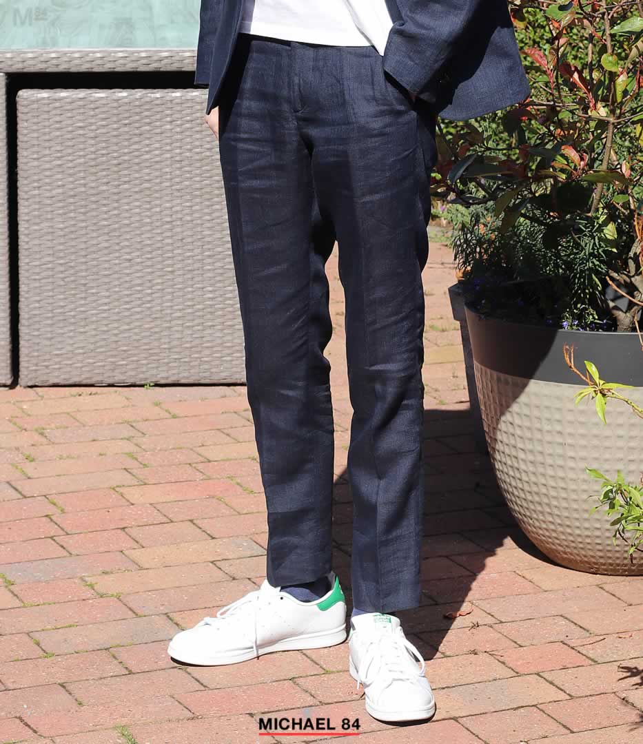 Navy suit with white trainers combination