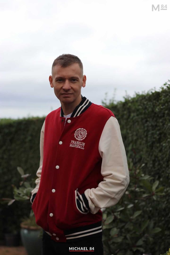 wearing letterman jacket